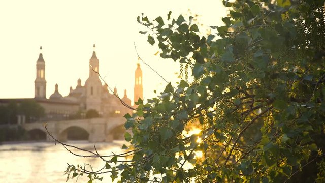 Sunset On the River In Zaragoza With Our Lady of the Pillar Basilica On The Background