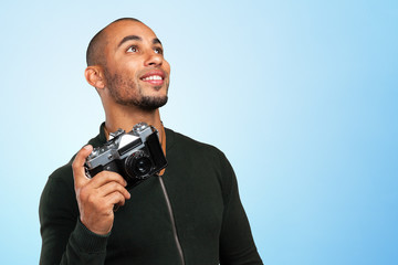 Portrait Of Young Man Carrying Camera