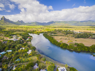 Fototapeta premium Top down aerial view of Black River Tamarin - Mauritius beach. Curepipe Black River Gorge National Park in background