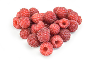 Heart shaped Red raspberries isolated on white