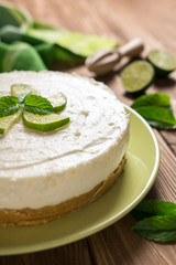 Obraz na płótnie Canvas No-bake cheesecake with lime, mascarpone, whipped cream and mint leaf