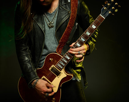 The guitarist plays solo.