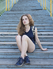 lonely girl teenager sitting on stairs