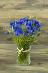 nice bluebottles bouquet in glass vase