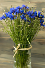 lovely bluebottles bouquet on wooden desk