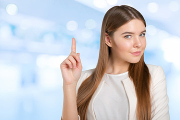 Businesswoman with finger point aside