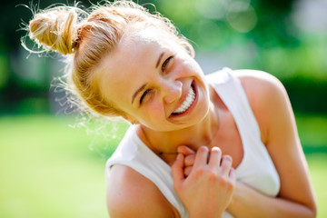 Beautiful young blond girl with beam on head