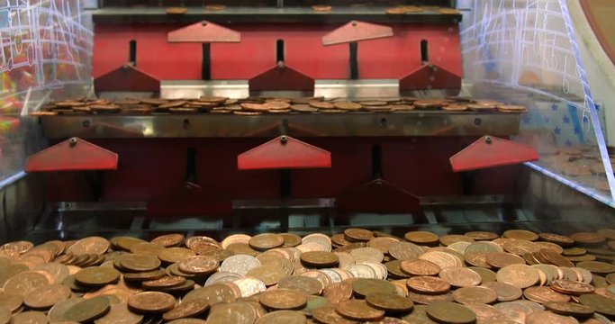 Old fashioned arcade money coin pushing machine