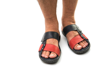 Men's feet in leather sandals