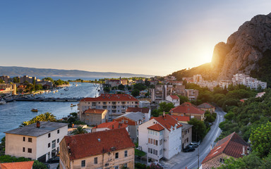 Fototapeta na wymiar Panoramic view of the town Omis, Cetina river and the island Brac, Adriatic coast of Mediterranean Sea, Dalmatia, Croatia
