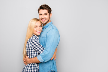 sweet happy cute couple in love hugs and smiling