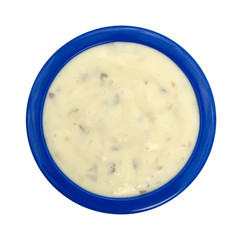 Bowl of tartar sauce on a white background.