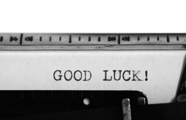 Typewriter. Typing text: good luck !