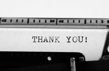 Typewriter. Typing text: thank you !