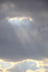 Naklejka na ściany i meble rays through the clouds