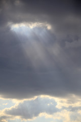 Fototapeta na wymiar rays through the clouds