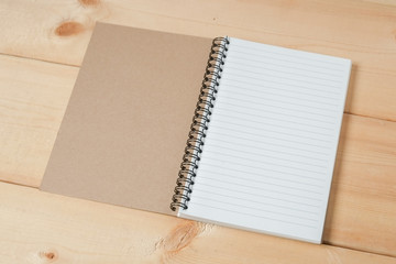 recycle notebook on wood background