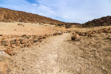 Footpath leading through volcanic landscape
