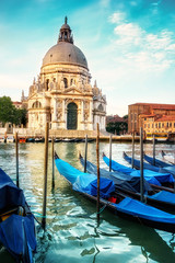 Fototapeta na wymiar Gondolas and Basilica Santa Maria della Salute in Venice