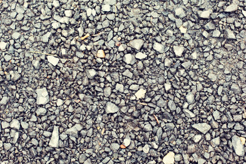 close up of gray macadam stones on ground
