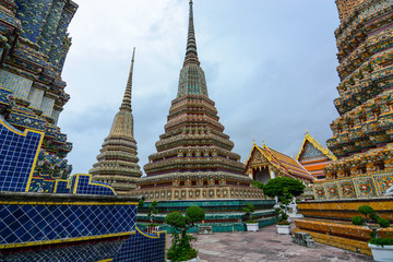 Naklejka premium View between giant chedis built for kings at the historic Wat Pho in Bangkok, Thailand