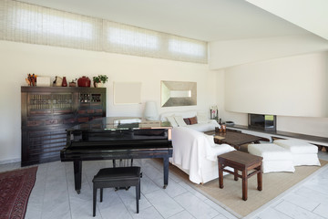 living room with piano of a modern house, interior