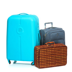The modern and retro suitcases on white background