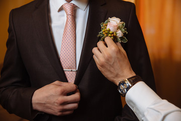 Groom in jacket with bouttonniere