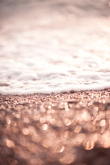 Sea shore at sunset light closeup. Selective focus.