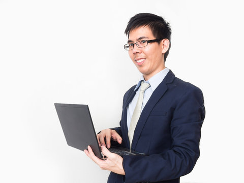 Asian business man wear glasses on professional suit with a lapt