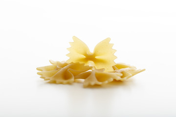 Pasta farfalle on white background