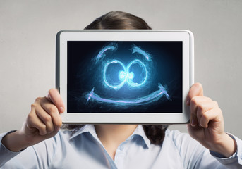 Woman use tablet device . Mixed media