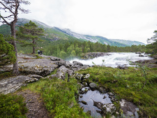 Naklejka na ściany i meble wild river in norwegian landscape