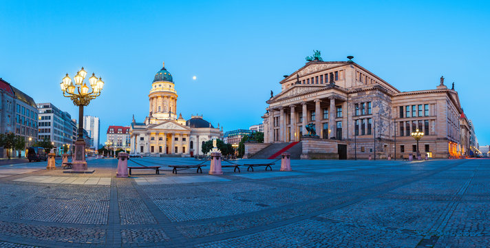 Panorama image of Gendarmenmarkt square in Berlin with German church and Concert Hall at dawn