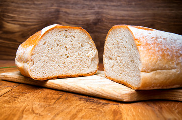Fresh bread on wooden background