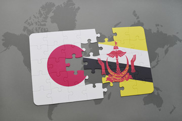 puzzle with the national flag of japan and brunei on a world map background.