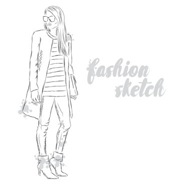 Fashion sketch. The girl in trousers and coats.