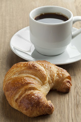 Fresh baked croissant and coffee