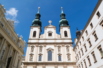 Fototapeta na wymiar Top facade of Jesuit Church or University Church on Ignaz Seipel Platz in Vienna, Austria