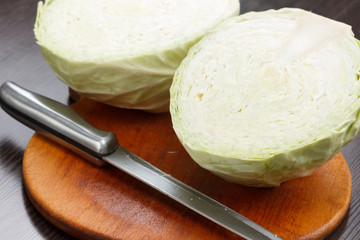 Cutting cabbage on a board