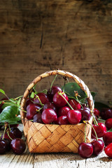 Maroon cherry in a basket, selective focus