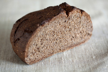 Half of freshly baked rustic, sourdough rye loaf of bread