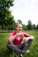 Pretty young girl / woman / lady drinking fresh / cold water aft