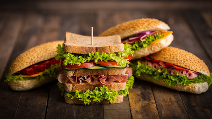 Sandwiches with ham and cheese on the table 