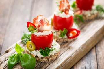 Canapes with stuffed cherry tomatoes 