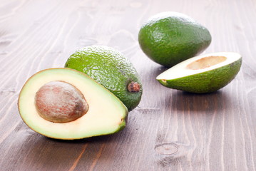 cut slices of avocado on a table