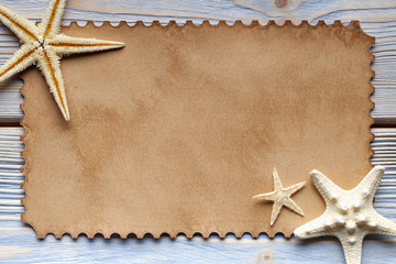 Fototapeta na wymiar Blank paper sheet and starfish on wooden background