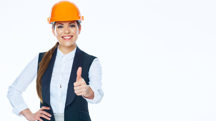 Woman builder in business suit show thumb up.