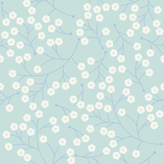 Cute seamless pattern with small flowers isolated on light blue
