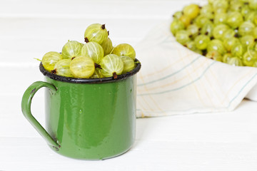 Grapes in an old metal green mug